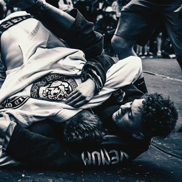 two men practicing jiu-jitsu
