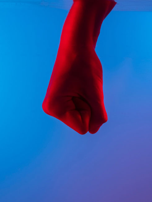 red fist over blue background
