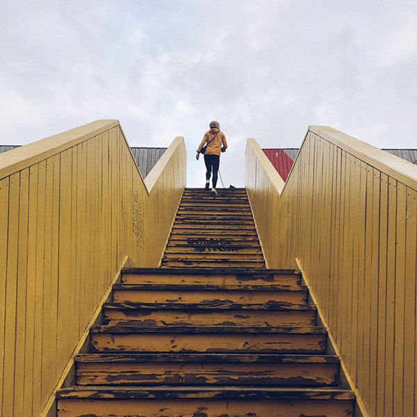 woman climbing stairs