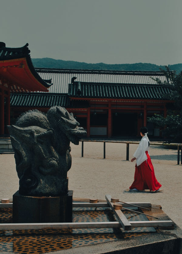 shinto-shrine miko walking at shinto shrine